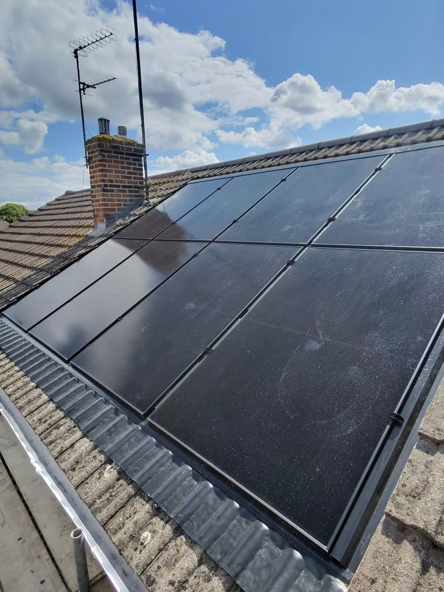 Residential roof-mounted solar panel installation