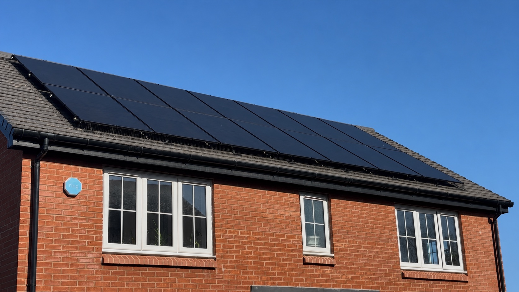 Black solar panels installed neatly on a residential roof